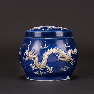 A BLUE GLAZED CARVED 'DRAGON' JAR WITH COVER 
