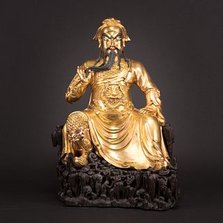 A GILT BRONZE FIGURE OF GUAN YU WITH STAND 