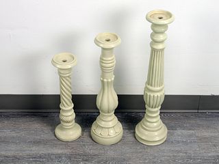 THREE PILLAR CANDLE HOLDERS OF VARYING HEIGHT