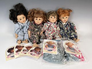 FOUR CUDDLY SISTERS DOLLS & TWO EXTRA OUTFITS