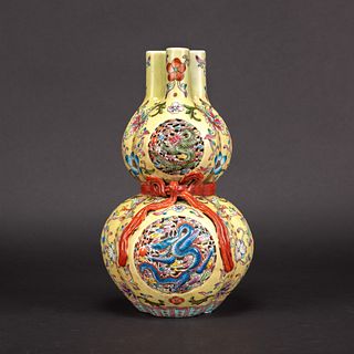A YELLOW-GROUND FAMILLE ROSE DOUBLE-GOURD VASE, QIANLONG MARK 