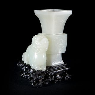 AN EXCEPTIONAL CARVED WHITE JADE LION DOG AND VASE WITH ZITAN WOOD STAND
