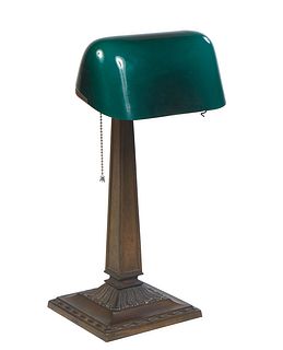 Emeralite Bronze Patinated Spelter Bankers Lamp, 20th c., #8734, patented 1916, with a cased green glass shade, labeled on the underside and outer rea