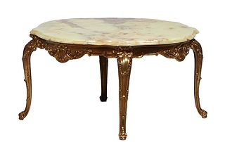 French Green Onyx and Brass Coffee Table, 20th c., the stepped circular highly figured top with four "cookie" edges, over a relief skirt, on relief de