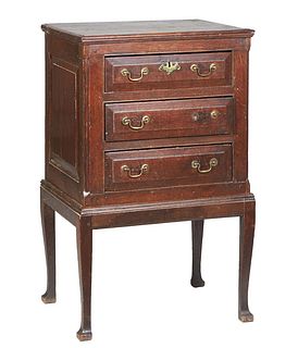 French Provincial Carved Oak Chest on Stand, 20th c., the stepped rectangular top over a setback bank of three drawers, on an oak stand on tapered squ