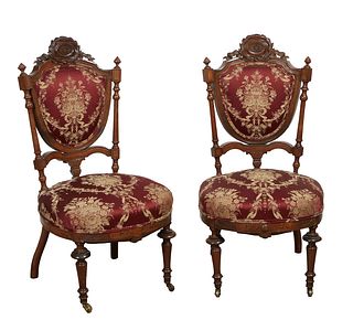 Pair of Inlaid Carved Rosewood Parlor Side Chairs, 19th c., attributed. to John Jelliff, the inlaid wreath form crest over a cushioned shield back fla