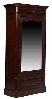 American Single Door Carved Mahogany Armoire, 19th c., the stepped canted corner crown over a mirror door, on a base with a long drawer, H.- 86 in., W