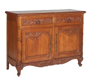 French Provincial Louis XV Style Carved Oak Sideboard, early 20th c., the stepped carved edge parquetry inlaid top above three frieze drawers over thr