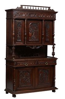 French Provincial Henri II Style Carved Oak Buffet a Deux Corps, c. 1880, the stepped crown over a relief frieze above three setback high relief figur