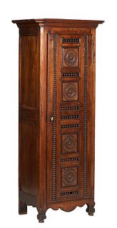 French Provincial Carverd Oak Bonnetiere, 20th c., Brittany, the ogee canted corner crown over a long door with carved spindled and wheel decoration, 
