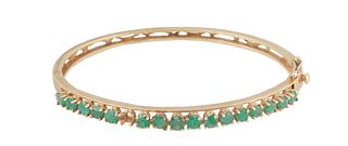 14K Yellow Gold Victorian Hinged Bangle Bracelet, the pierced band topped with 16 graduated round emeralds, one emerald lacking, H.- 3/8 in., Int. H.-