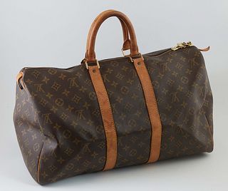 Louis Vuitton Brown Monogram Coated Canvas 45 Keepall Travel Bag, the vachetta leather straps with golden brass hardware, opening to a brown canvas li