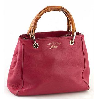 Gucci Magenta Grained Calf Leather 25 Mini Bamboo Shopper Handbag, the bamboo handles with golden hardware and adjustable leather strap, the magnetic 