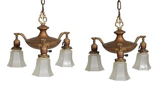 Diminutive Pair of American Hanging Brass and Iron Hall Chandeliers, early 20th c., of urn form, issuing three brass leaf form lights with frosted gla