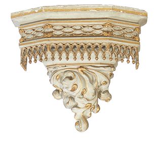 Large Polychromed Plaster Wall Bracket, 20th c., the stepped hexagonal top over a setback relief frieze with a pierced arched gallery, above a large s