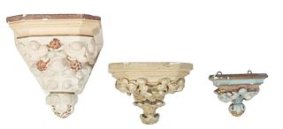 Group of Three French Louis XVI Polychromed Plaster Wall Brackets, early 20th c., with stepped hexagonal tops over relief fruit and floral supports, H