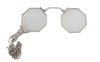 Lady's Platinum Art Deco Diamond Mounted Folding Lorgnette. early 20th c., with octagonal lenses , the chain with nine round diamnd links, H.- 2 7/8 i