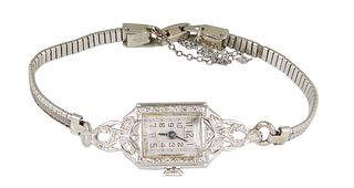 14K White Gold Bulova Diamond Mounted Lady's Wrist Watch, early 20th c., with an Adler's watch face, and a 10K white gold mesh band.