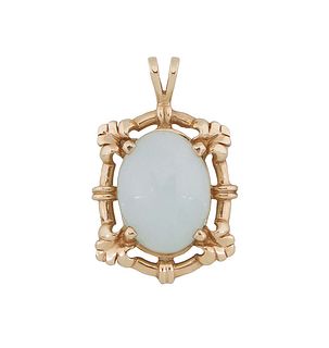 14K Yellow Gold Jade Pendant, with a cabochon white jade oval stone, within a pierced oval leaf mounted frame, H.- 1 3/16 in., W.- 3/4 in. Provenance: