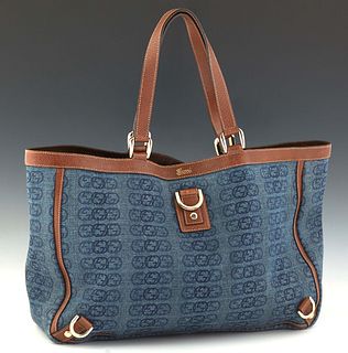 Gucci Tote Bag, in interlocking monogrammed blue denim canvas with brown leather accents and gold hardware, opening to a dark brown canvas lined inter
