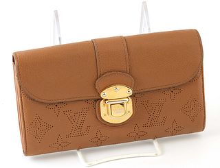 Louis Vuitton Cognac Monogram Mahina Iris Wallet, the calf leather with golden brass buckle clasp, opening to three bill compartments, three card hold