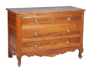 French Provincial Louis XV Style Carved Walnut Commode, 19th c., the ogee edge rounded corner rectangular top over three drawers flanked by rounded ed
