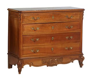 French Louis XV Style Carved Walnut Marble Top Commode, early 20th c., the inset highly figured rouge marble over a frieze drawer and three deep drawe