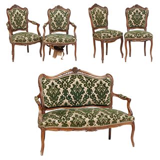 French Louis XV Style Carved Walnut Five Piece Parlor Suite, 20th c., consisting of a settee, two fauteuils and two side chairs, the arched canted flo