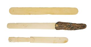 Three Ivory Page Turners, 19th c., one Chinese with a relief brass dragon handle mounted with a cabochon agate, Chinese- H.- 11 1/4 in.,W.- 1 1/8 in.,