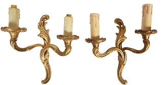 Pair of French Gilt Bronze Louis XV Style Two Light Sconces, 20th c., the leaf form back plate issuing two relief decorated curved arms, H.- 9 1/2 in.