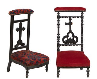 Two French Ebonized Prie Dieus, c. 1870., the curved upholstered arm rest over a cruciform back splat, one flanked by turned supports; the second flan