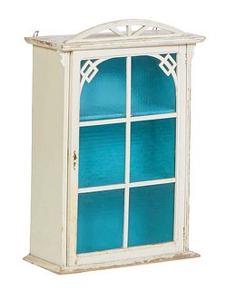 French Provincial Polychromed Beech Hanging Cabinet, early 20th c., the pierced arched crest over an arched mullioned blue glass door, H.- 29 1/2 in.,