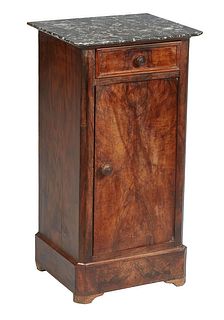 French Louis Philippe Carved Walnut Marble Top Nightstand, 19th c., the canted corner highly figured gray marble over a frieze drawer and a long cupbo