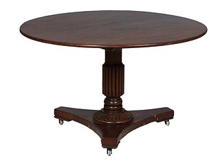 English Carved Walnut Tilt Top Tea Table, late 19th c., the circular top on a reeded columnar support to a reeded socle, on a tripartite base with por
