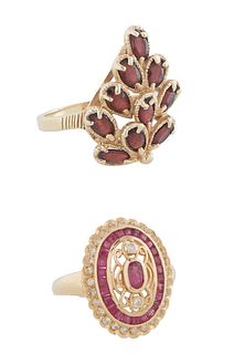 Two Lady's 14K Yellow Gold Dinner Rings, one with an oval ruby atop a pierced band and an outer border of small round diamonds, Size 9; together with 