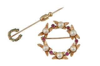 Two 14K Yellow Gold Pins, one a stick pin with a round emerald mounted horseshoe; and a circular leaf form brooch mounted with six 5mm cultured pearls