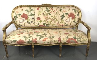 A Louis XV Giltwood Floral Upholstered Settee
