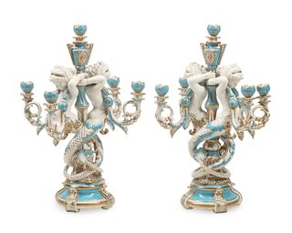 A pair of French Sevres-style porcelain candelabra