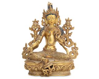 A bronze figure of Tara