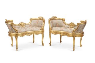 A pair of Louis XV-style giltwood window seats