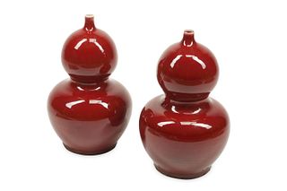 A pair of Chinese oxblood porcelain gourd vases