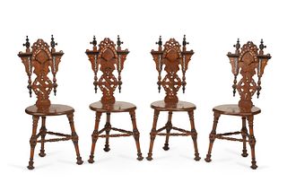 A set of Iberian carved wood hall chairs
