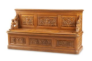 A Renaissance-style carved wood bench