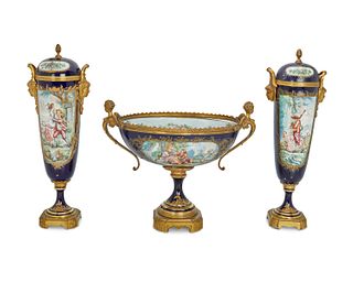A Sevres-style porcelain centerpiece and garniture urns