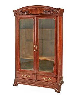 An Art Nouveau walnut double-door bookcase