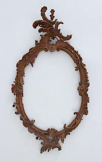 ITALIAN ROCOCO STYLE CARVED GILTWOOD OVAL FRAME