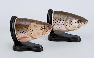 PAIR OF ENGLISH PORCELAIN FISH-HEAD STIRRUP CUPS, NOW MOUNTED AS EBONIZED WOOD BOOKENDS