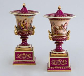 PAIR OF VIENNA PORCELAIN PICTORIAL CAMPANI-FORM URNS AND COVERS