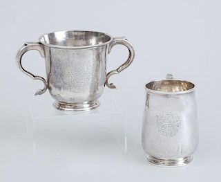 GEORGE III ARMORIAL SILVER MUG AND GEORGE I ARMORIAL SILVER TWO-HANDLED CUP