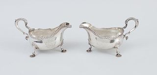 PAIR OF EARLY GEORGE III ARMORIAL SILVER TRIPOD SAUCE BOATS, OF AMERICAN INTEREST, WITH LATER INSCRIPTIONS